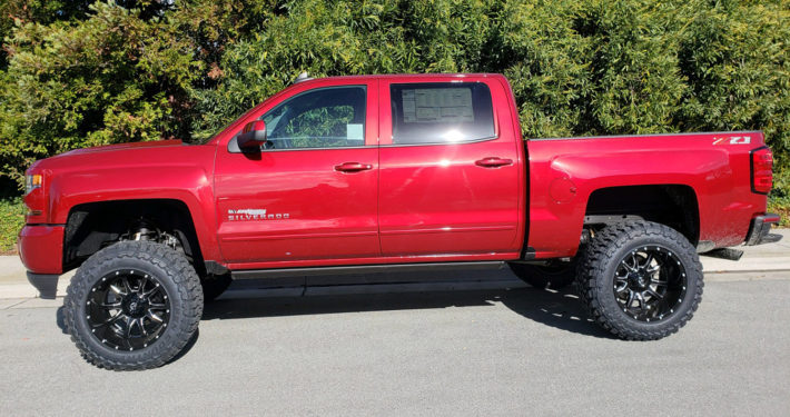 2018 Chevy 1500 Crew Cab #1T1996 6'' Suspension System, Fuel Vandal  20x12 Rims, 35″ Toyo Open Country M/T, AMP Electric Side Boards, Dual Exhaust W/ Black Tips, Hypertech Speedo Calibrator.